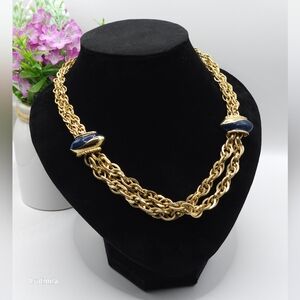 Gold-toned double-stranded metal chain necklace connected by two large‎ spacers